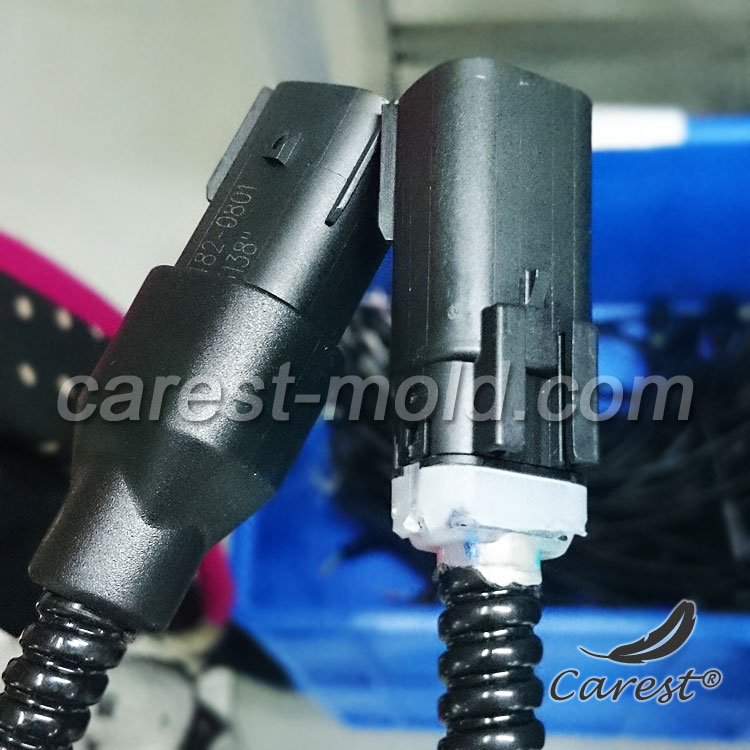 Waterproof connector with metal shield PVC overmoulding